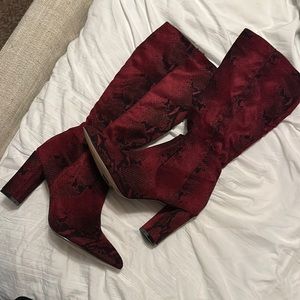 Red snake skin high boots